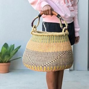 Girl holding an African basket that looks like a honey pot